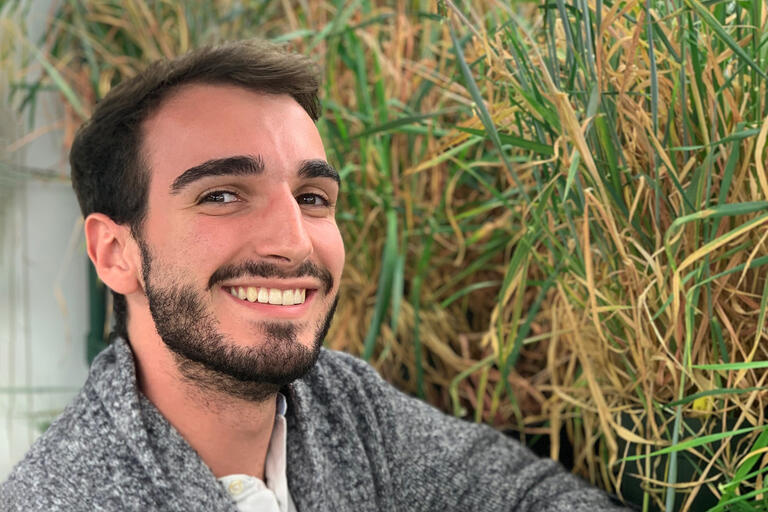Headshot of Nicholas Karavolias in front of research rice