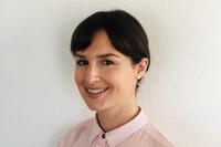 Headshot of Julia Brown in front of a white wall